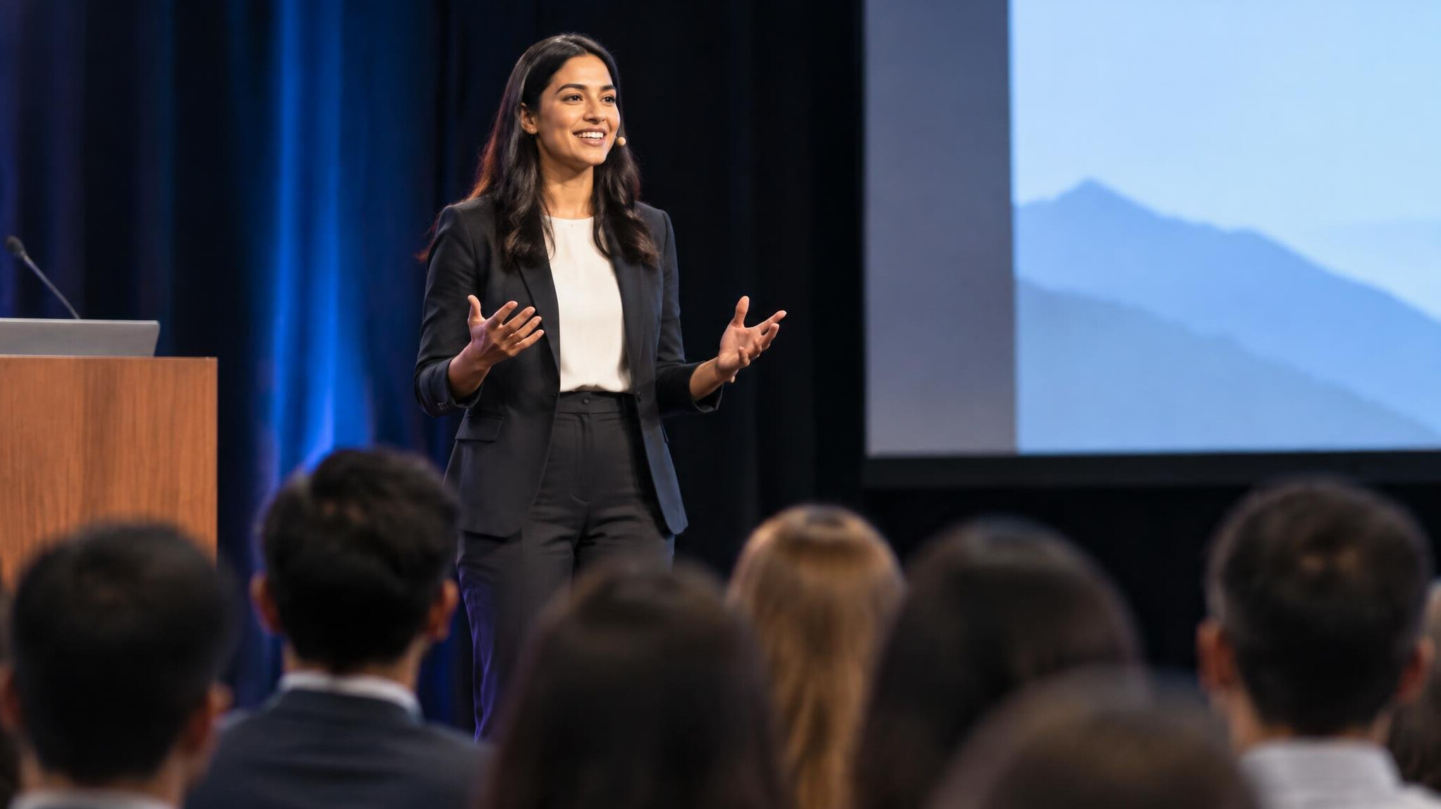 person giving speech on stage